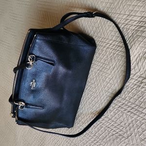Coach black purse with gold hardware and crossbody straps